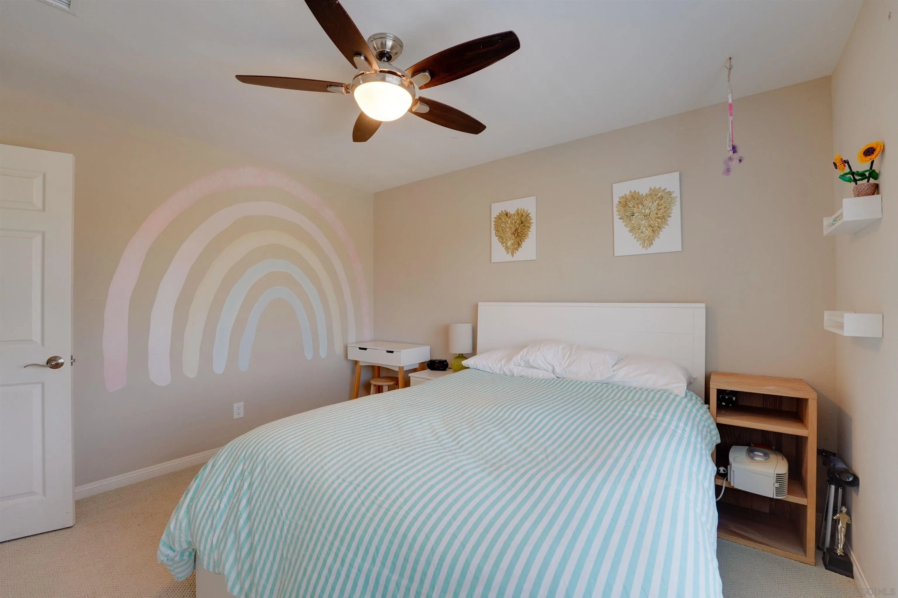 1647 Hawk View Drive Encinitas, CA 92024 - Photo 28 of 73 a bedroom with a bed and a chandelier