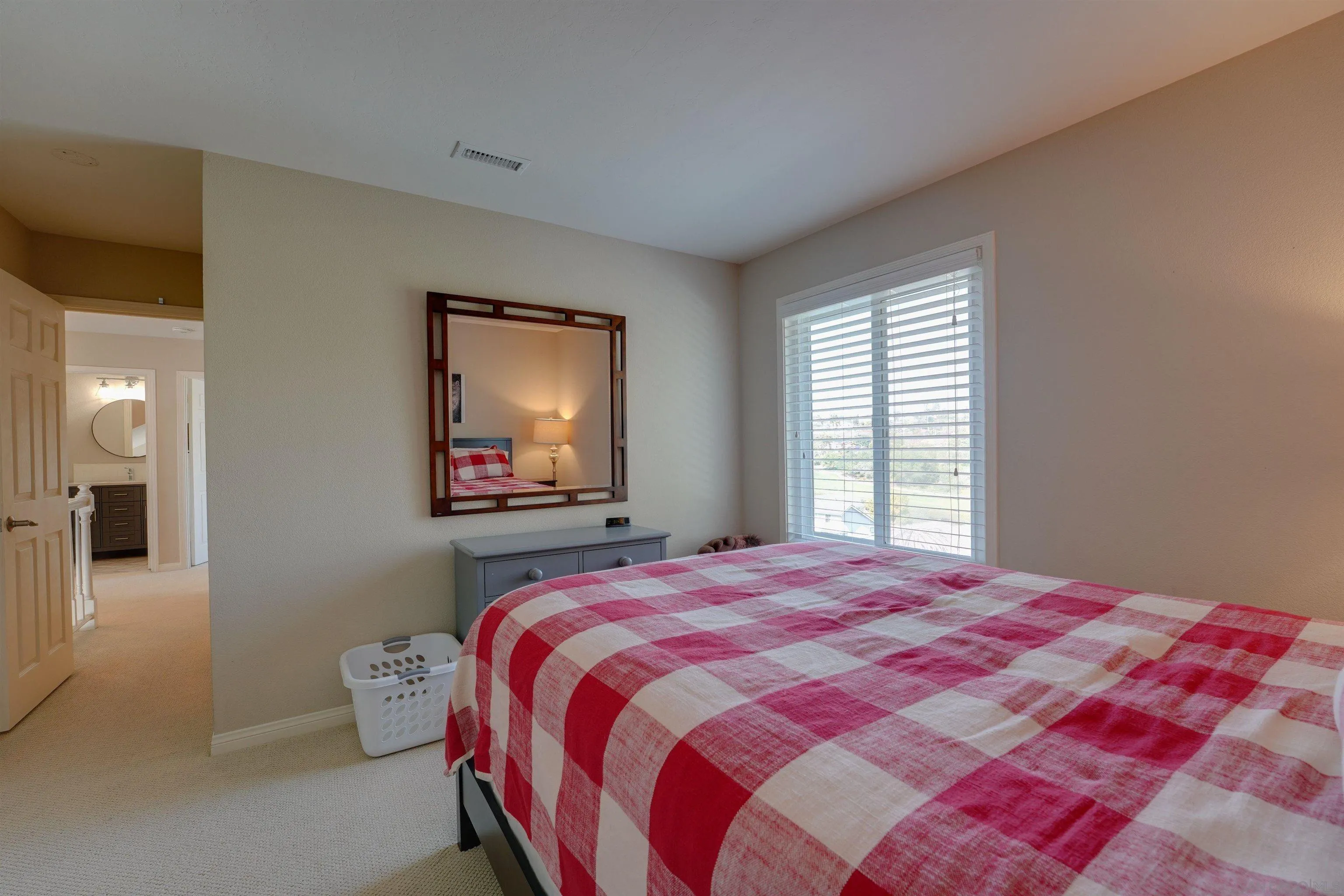 1647 Hawk View Drive Encinitas, CA 92024 - Photo 34 of 73 a bedroom with a bed and a flat screen tv