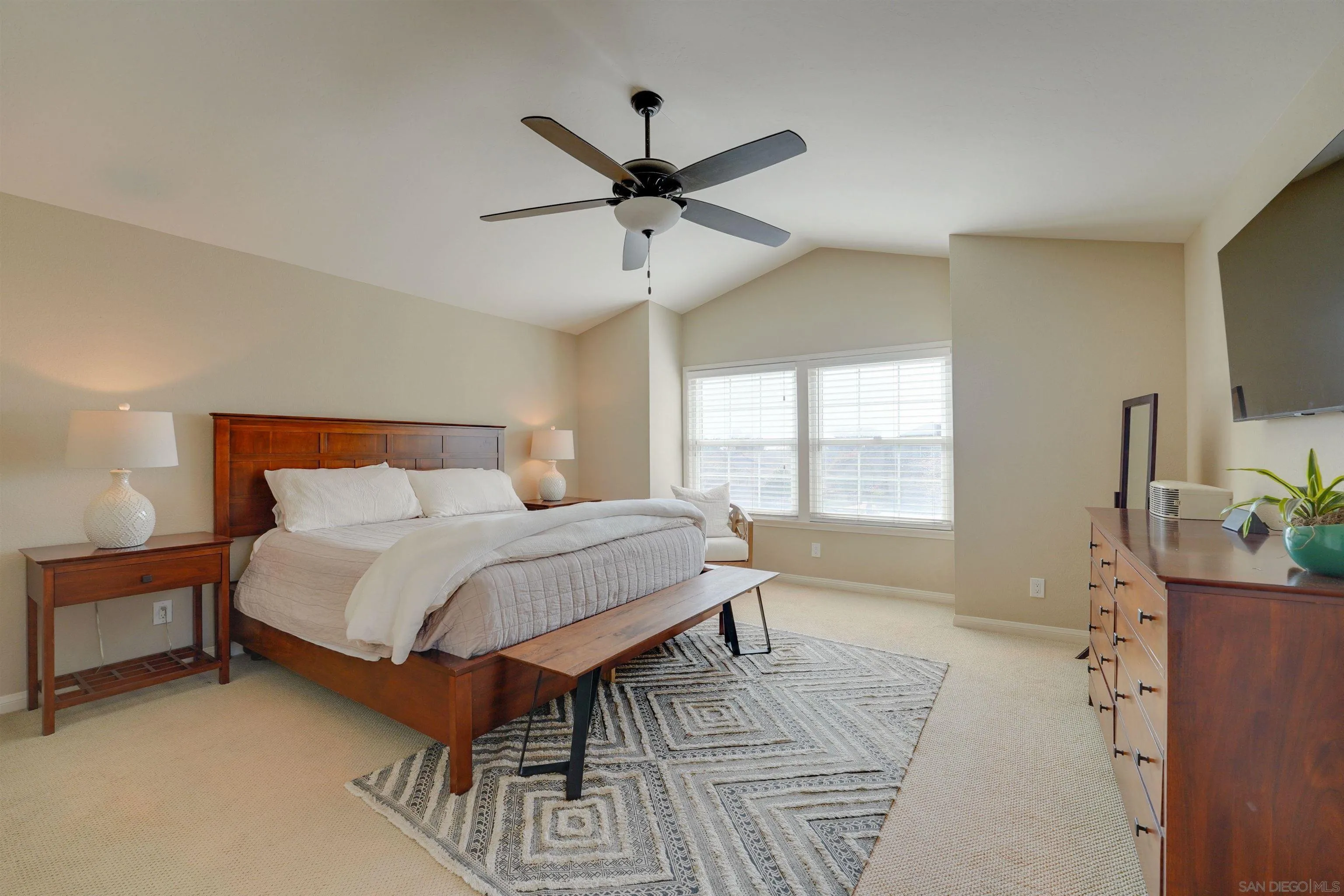 1647 Hawk View Drive Encinitas, CA 92024 - Photo 38 of 73 a bedroom with a bed a window and a flat screen television