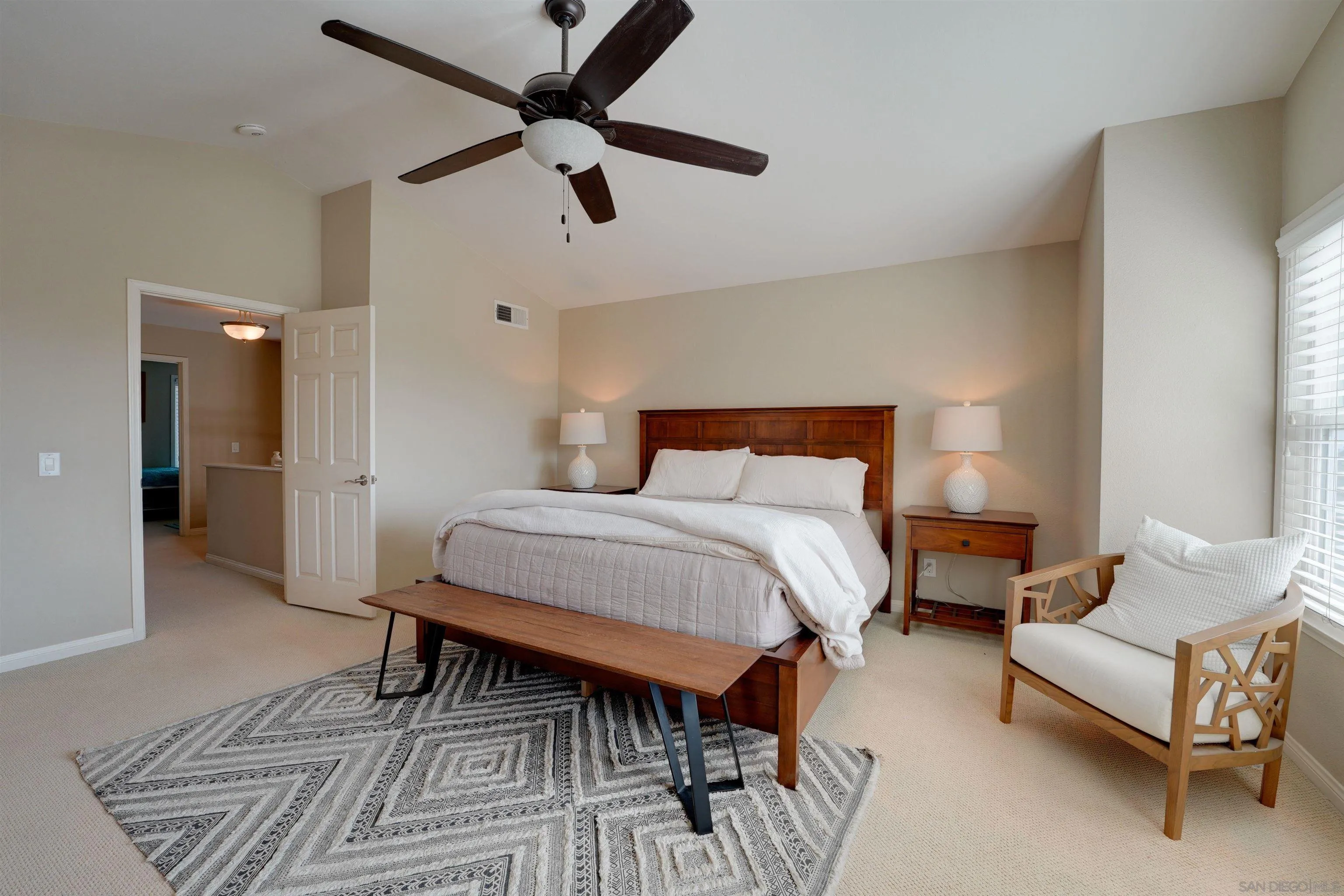 1647 Hawk View Drive Encinitas, CA 92024 - Photo 39 of 73 a bedroom with a bed and a couch