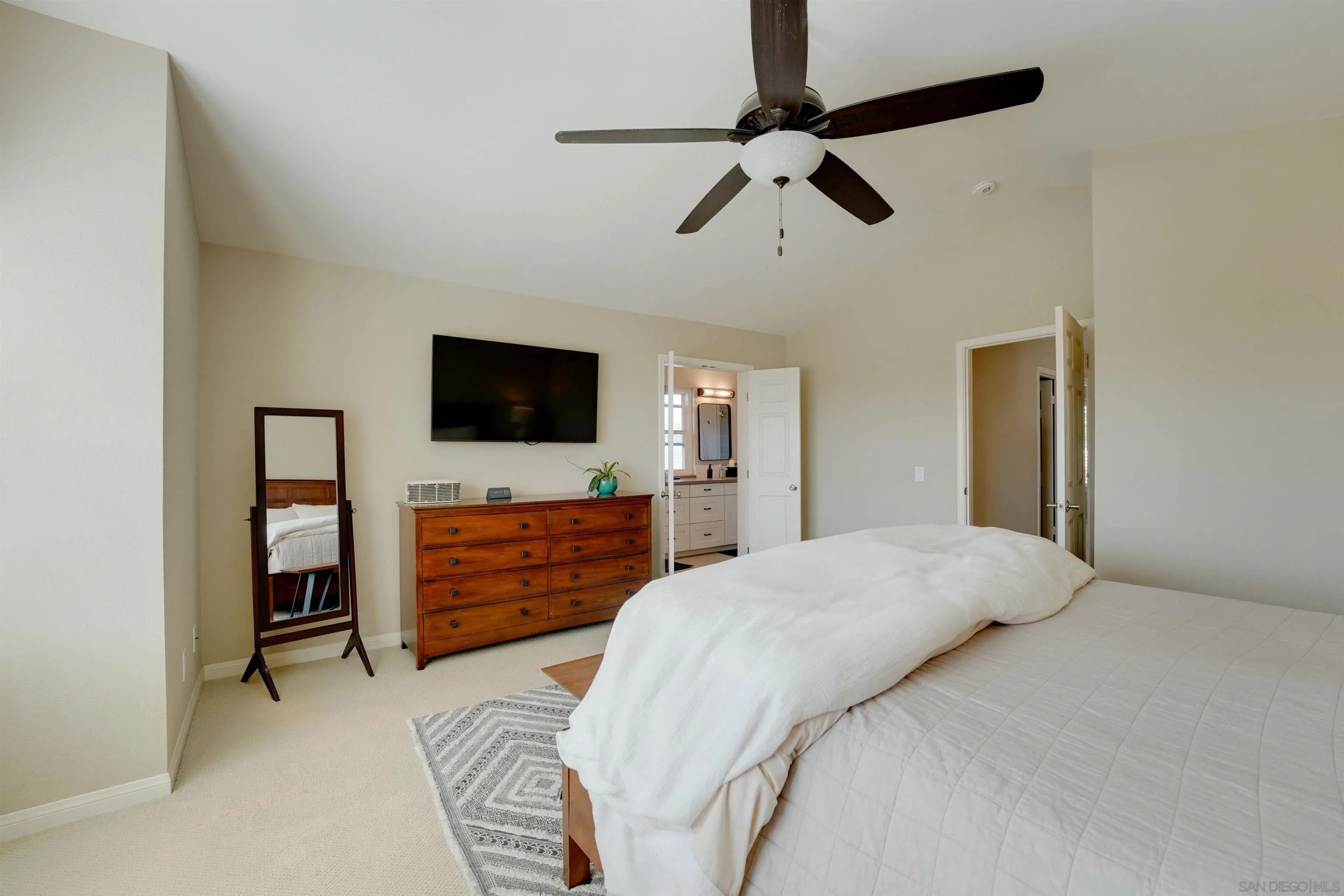 1647 Hawk View Drive Encinitas, CA 92024 - Photo 40 of 73 a bedroom with a bed and a flat screen tv