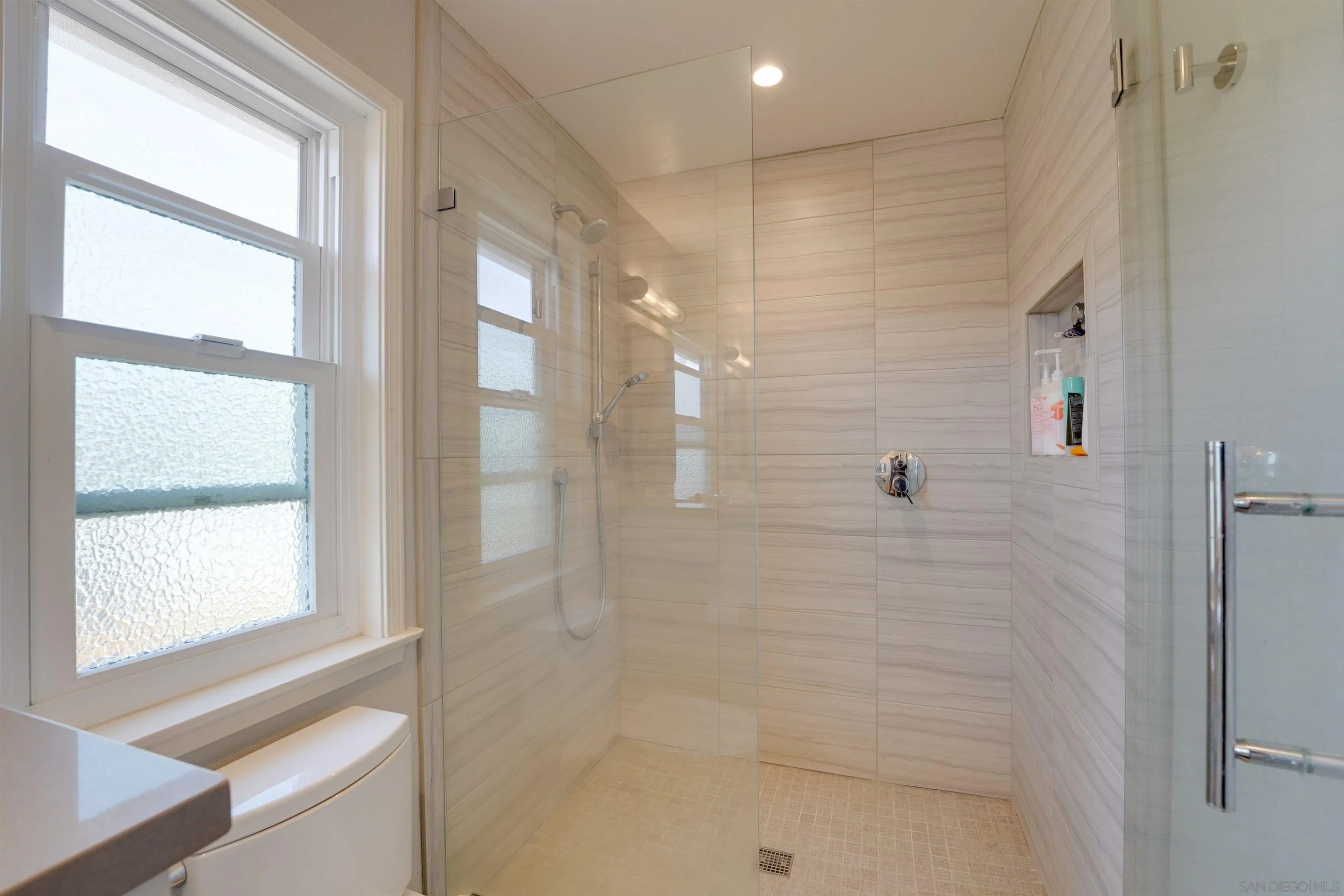 1647 Hawk View Drive Encinitas, CA 92024 - Photo 44 of 73 a bathroom with a bathtub and a shower