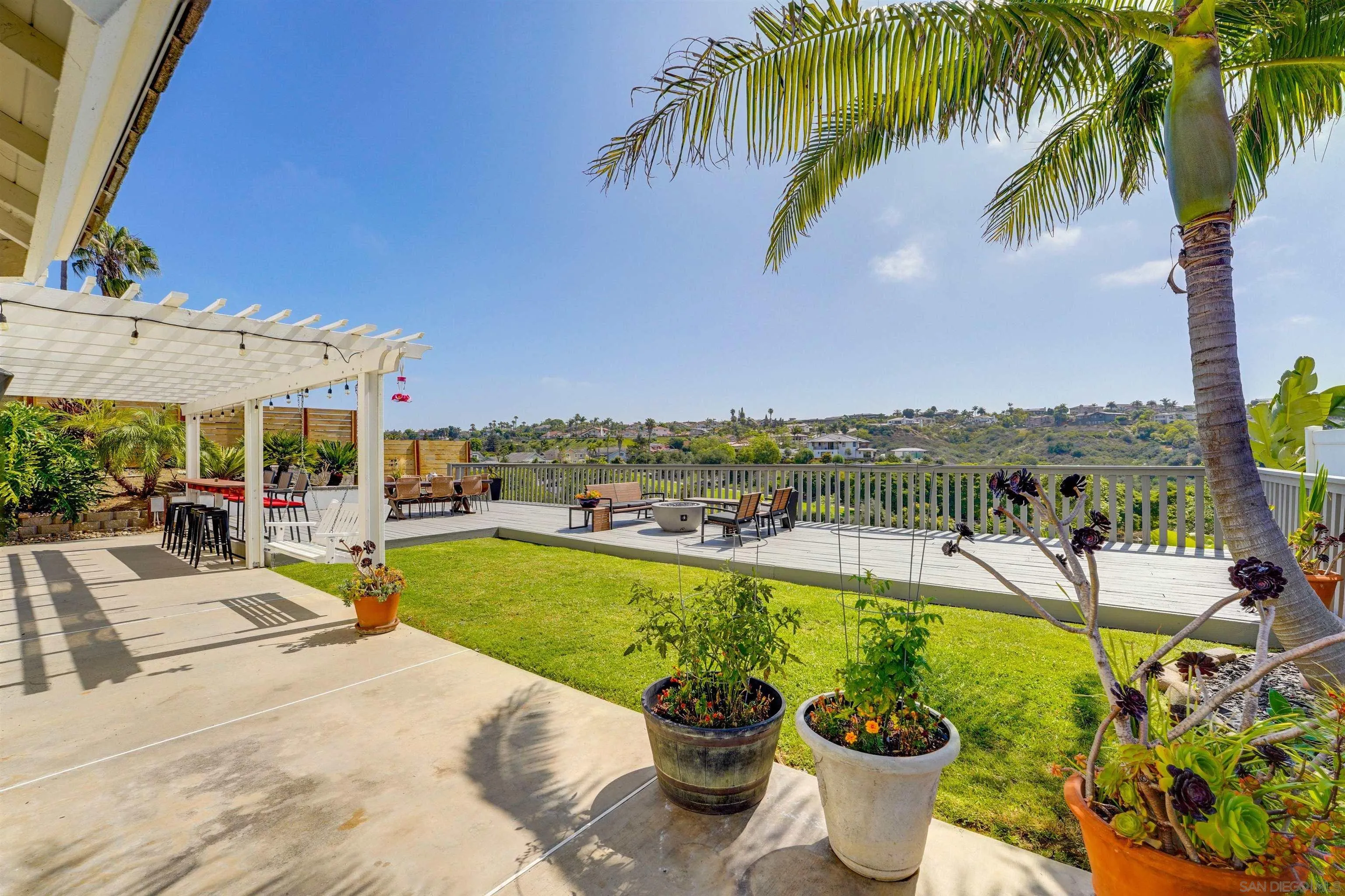 1647 Hawk View Drive Encinitas, CA 92024 - Photo 45 of 73 a view of a swimming pool and lounge chairs