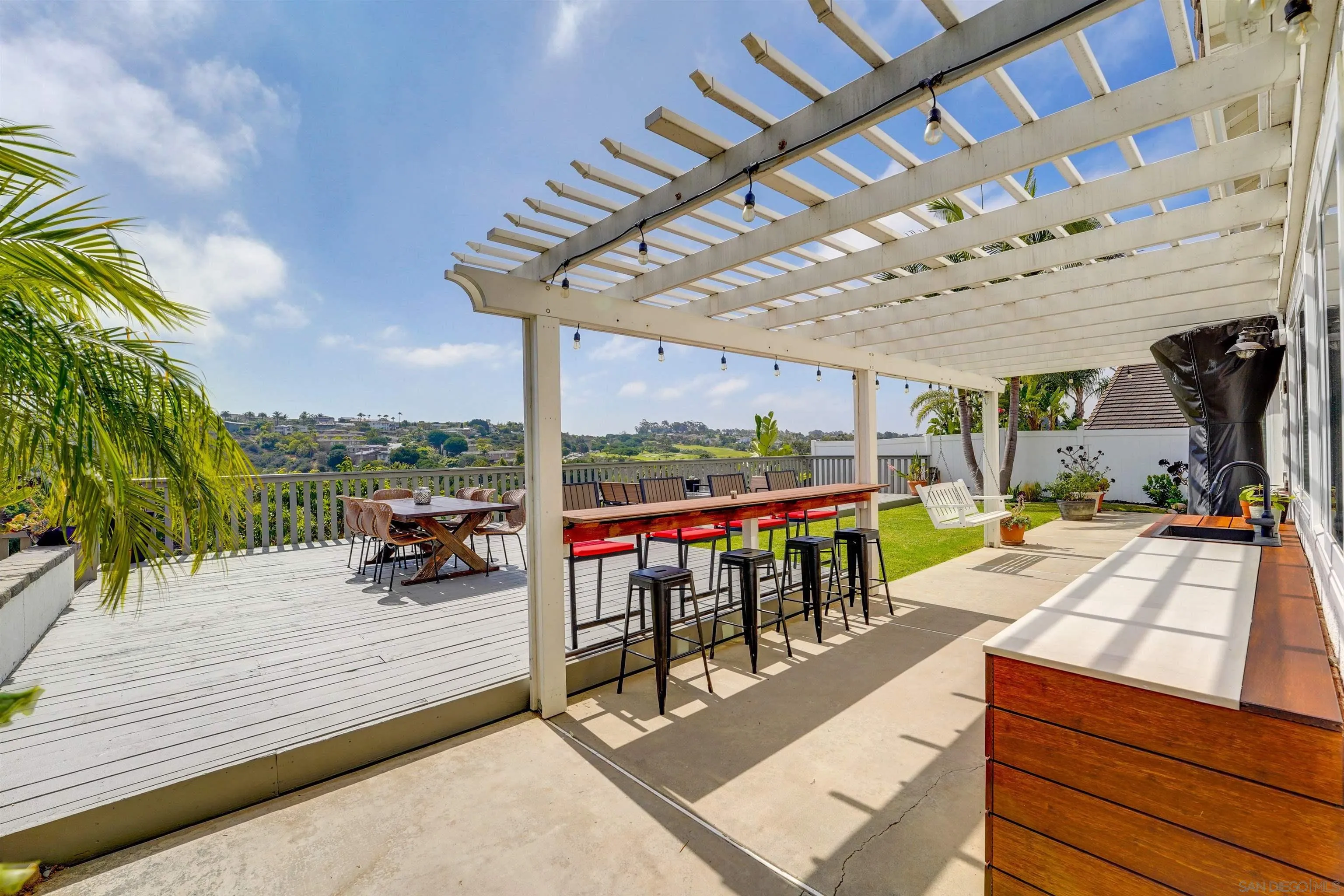 1647 Hawk View Drive Encinitas, CA 92024 - Photo 59 of 73 a view of a patio with a table and chairs