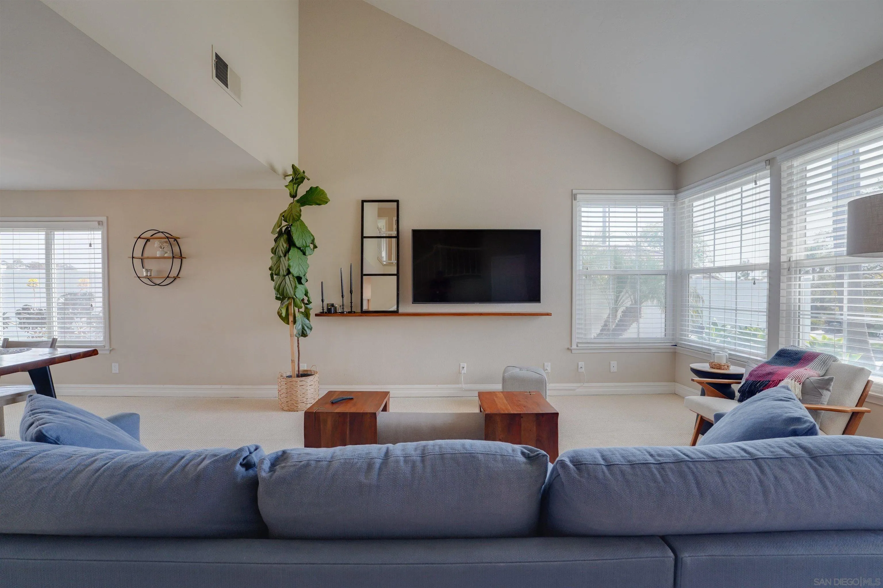 1647 Hawk View Drive Encinitas, CA 92024 - Photo 6 of 73 a living room with furniture and a flat screen tv