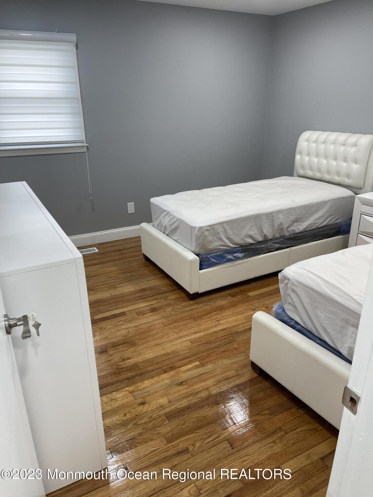 6 Dwight Drive Asbury Park, NJ 07712 - Photo 9 of 16 a bedroom with a bed and a couch