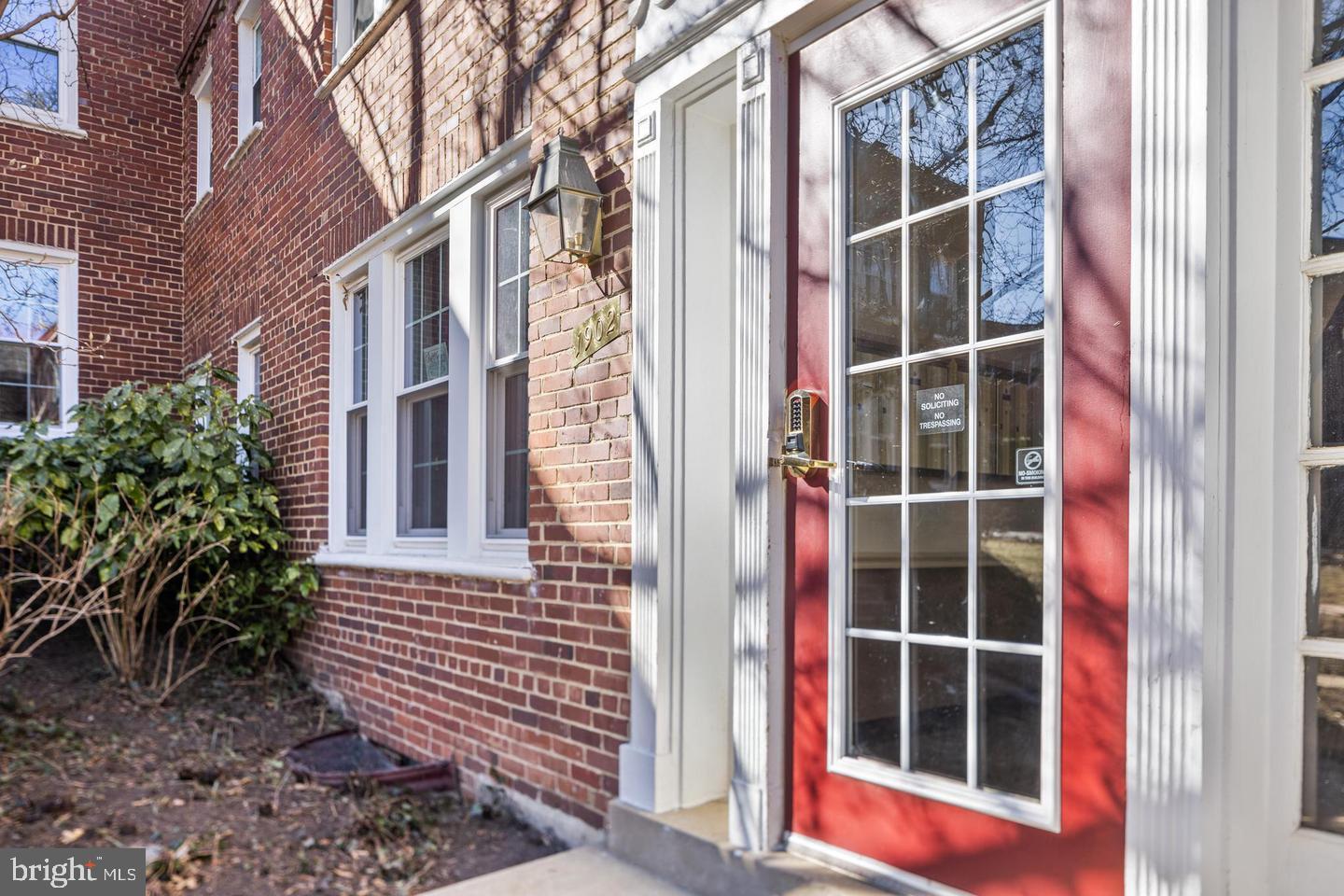 1902 North Rhodes Street, Unit 66 Arlington, VA 22201 - Photo 1 of 28 a view of a door with a door and wooden walls