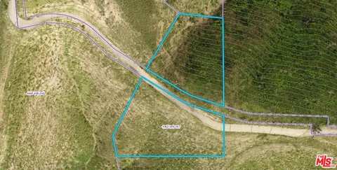 a bathroom with a shower and a glass door shower