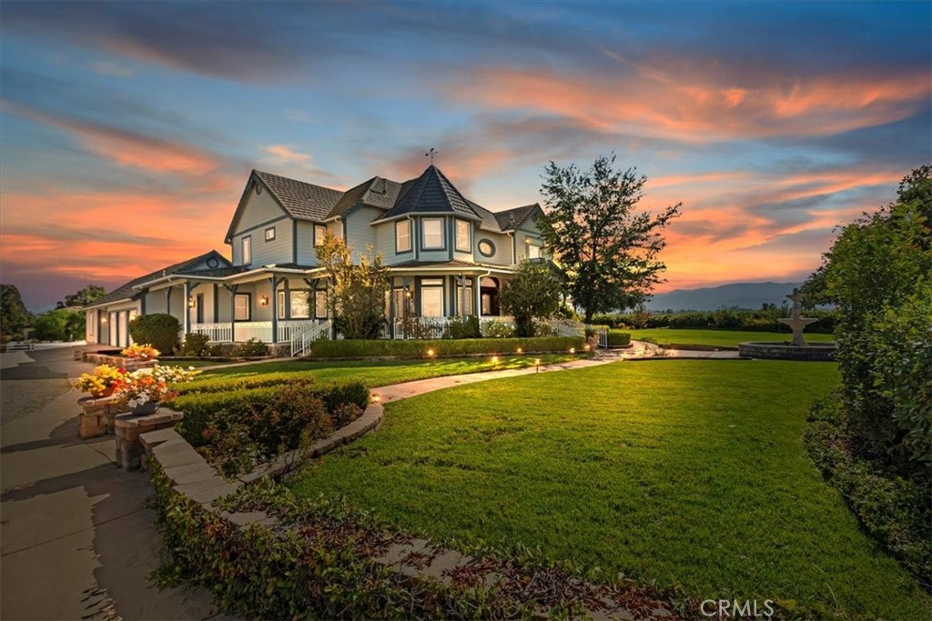 39650 Patagonia Court Temecula, CA 92591 - Photo 2 of 55 a front view of a house with a garden