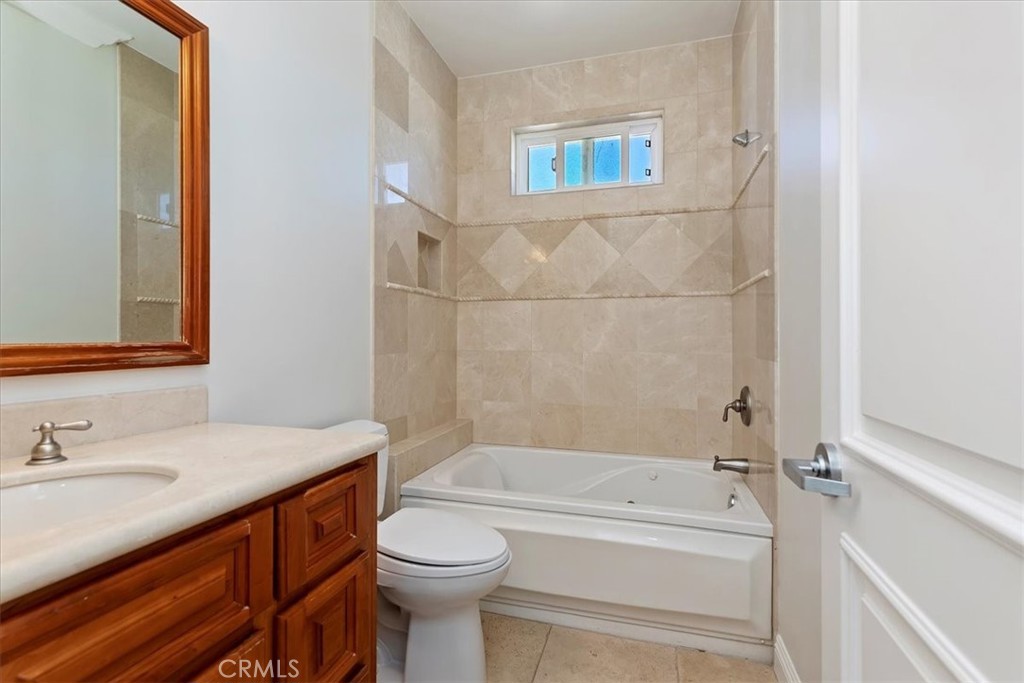 39650 Patagonia Court Temecula, CA 92591 - Photo 22 of 55 a bathroom with a sink a toilet and bathtub