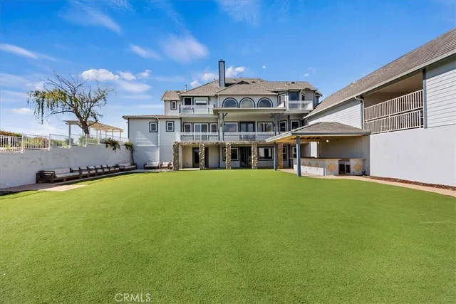 a kitchen with stainless steel appliances a refrigerator sink and microwave