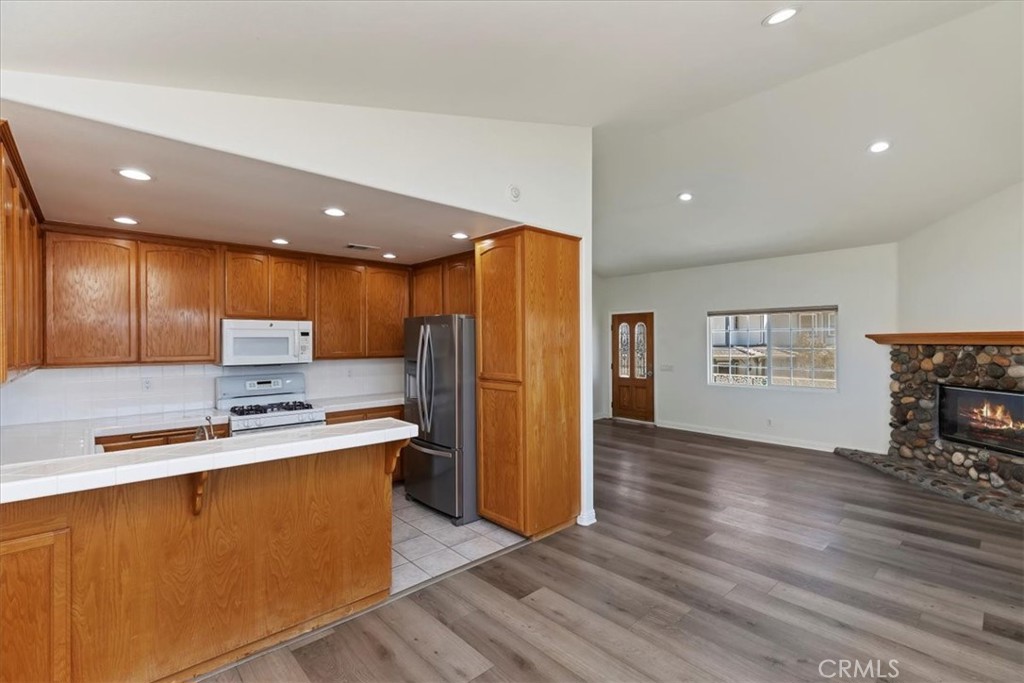 39650 Patagonia Court Temecula, CA 92591 - Photo 39 of 55 a kitchen with stainless steel appliances a refrigerator sink and microwave