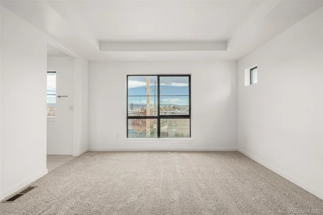 a bathroom with a shower a toilet and a sink