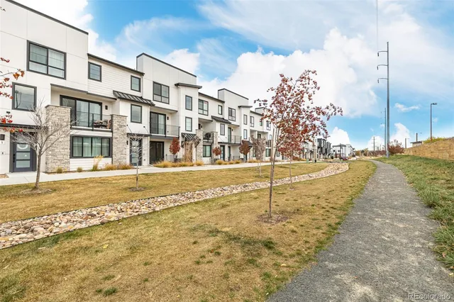 a swimming pool with an outdoor seating and a view of lake