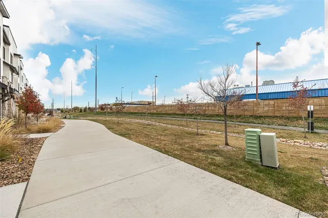 a view of a swimming pool with a yard