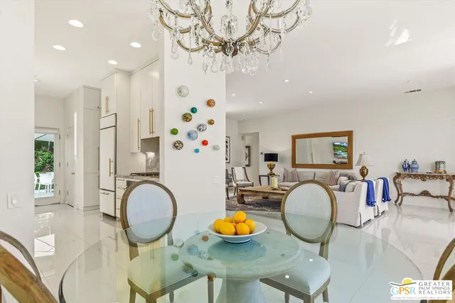 a dining room with furniture and wooden floor