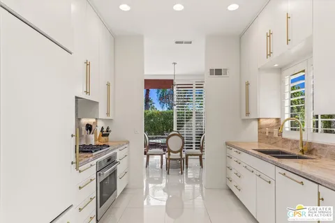 a kitchen with appliances cabinets and a counter top space