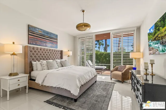 a bedroom with a bed and a cabinets