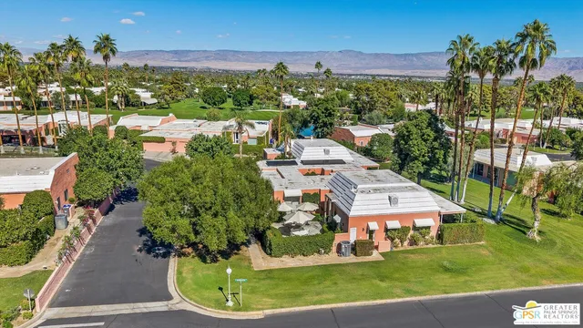 a swimming pool with outdoor seating