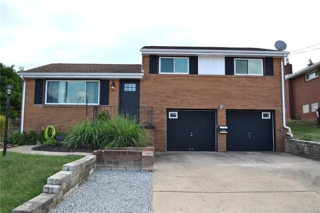 a house view with a garden space