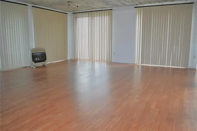 a view of a livingroom with wooden floor