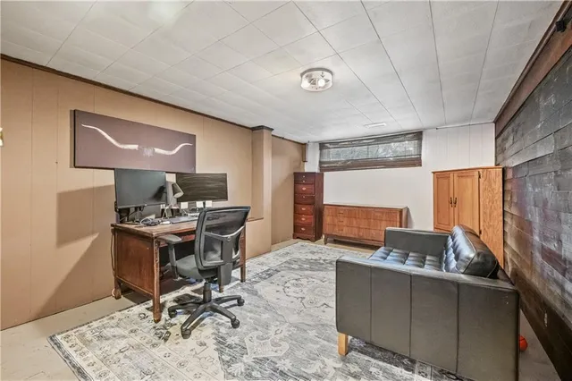 a workspace with furniture and window