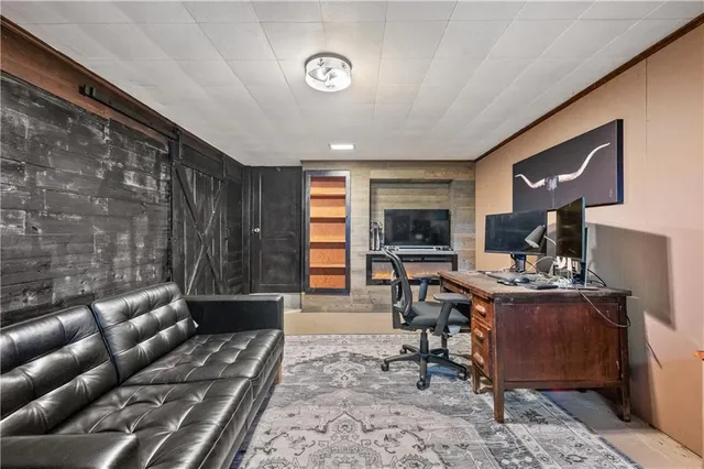 a living room with furniture a rug and a window