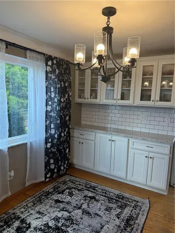 a kitchen with a refrigerator and cabinets