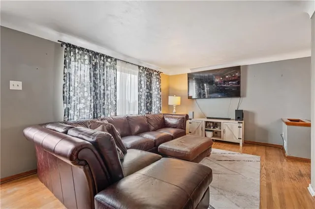 a bedroom with furniture and a flat screen tv