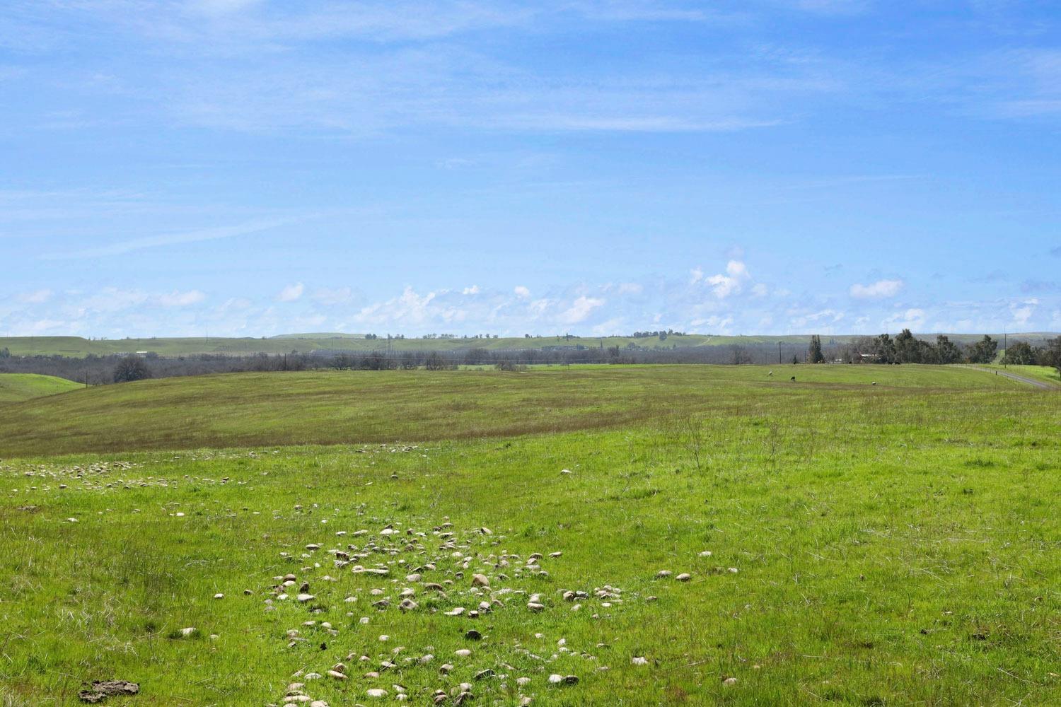11750 North Wimer Road Linden, CA 95236 - Photo 16 of 69 a view of a large body of water with a building in the background