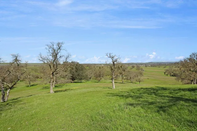a view of a lake with a big yard