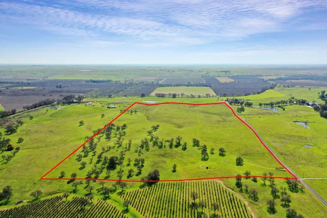 a view of a swimming pool with a yard