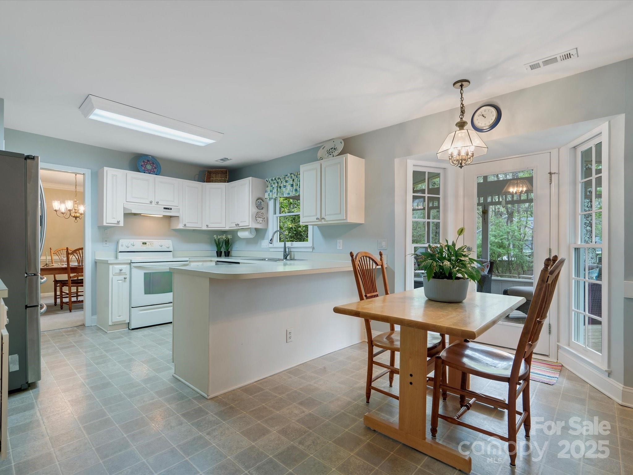 2812 Edgebrook Circle Matthews, NC 28105 - Photo 11 of 46 a kitchen with a table and chairs in it