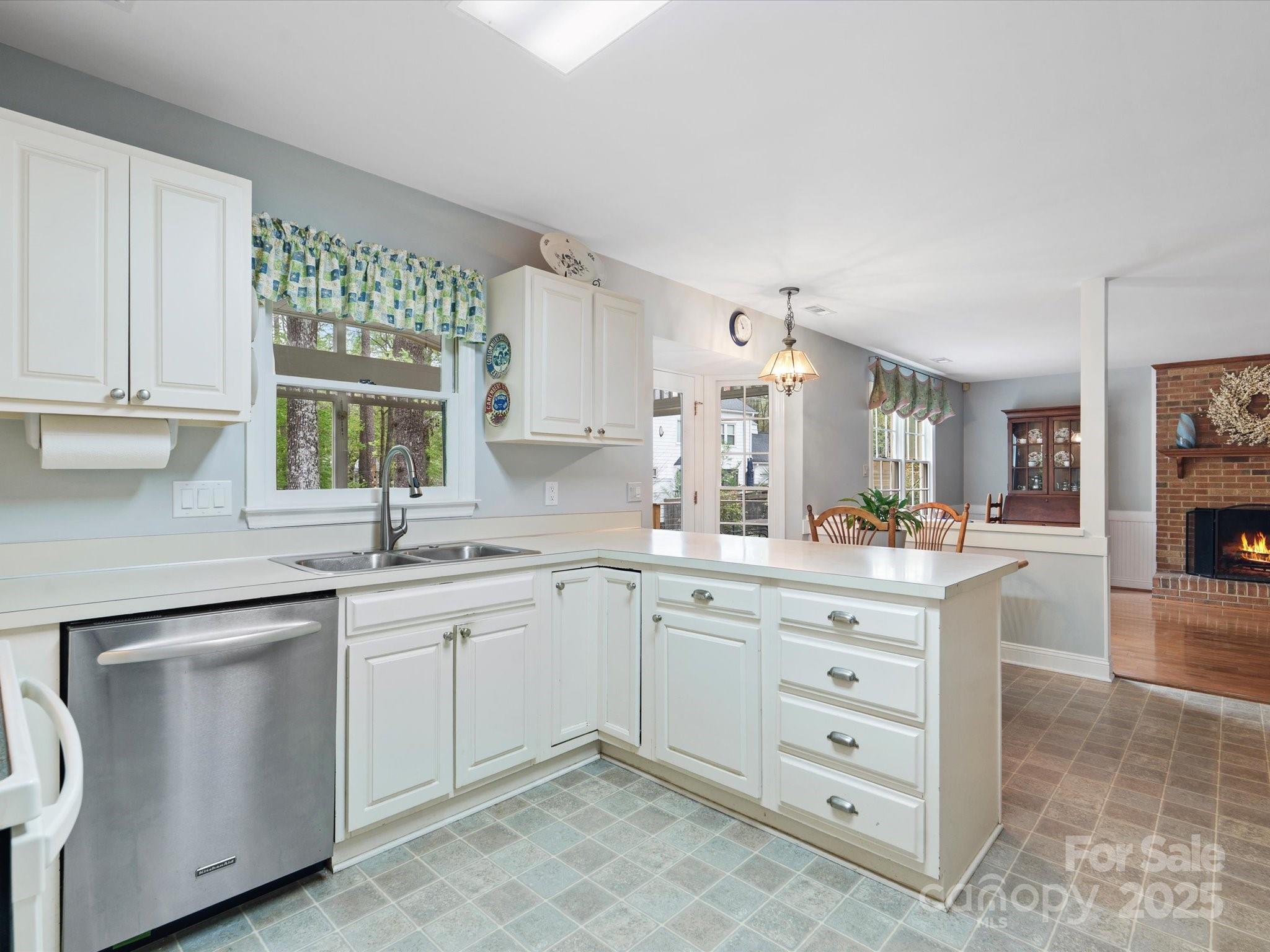 2812 Edgebrook Circle Matthews, NC 28105 - Photo 12 of 46 a kitchen with white cabinets and sink