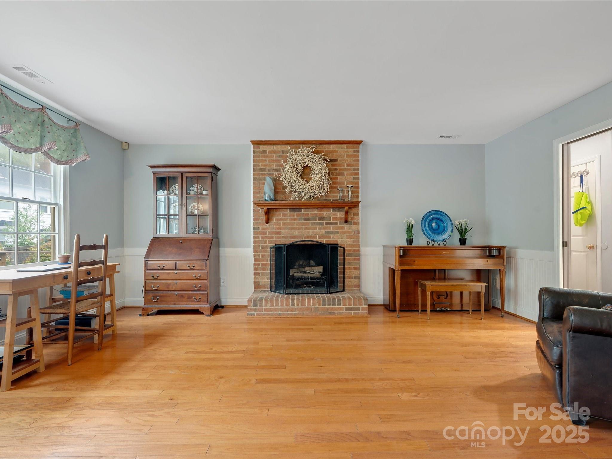 2812 Edgebrook Circle Matthews, NC 28105 - Photo 15 of 46 a living room with furniture a fireplace and a window