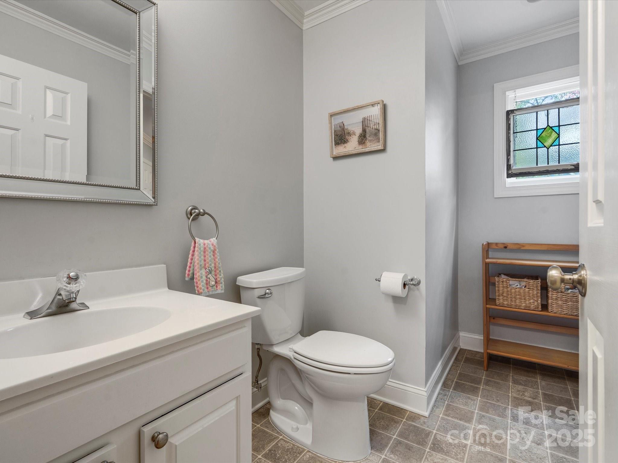 2812 Edgebrook Circle Matthews, NC 28105 - Photo 18 of 46 a bathroom with a toilet a sink and mirror