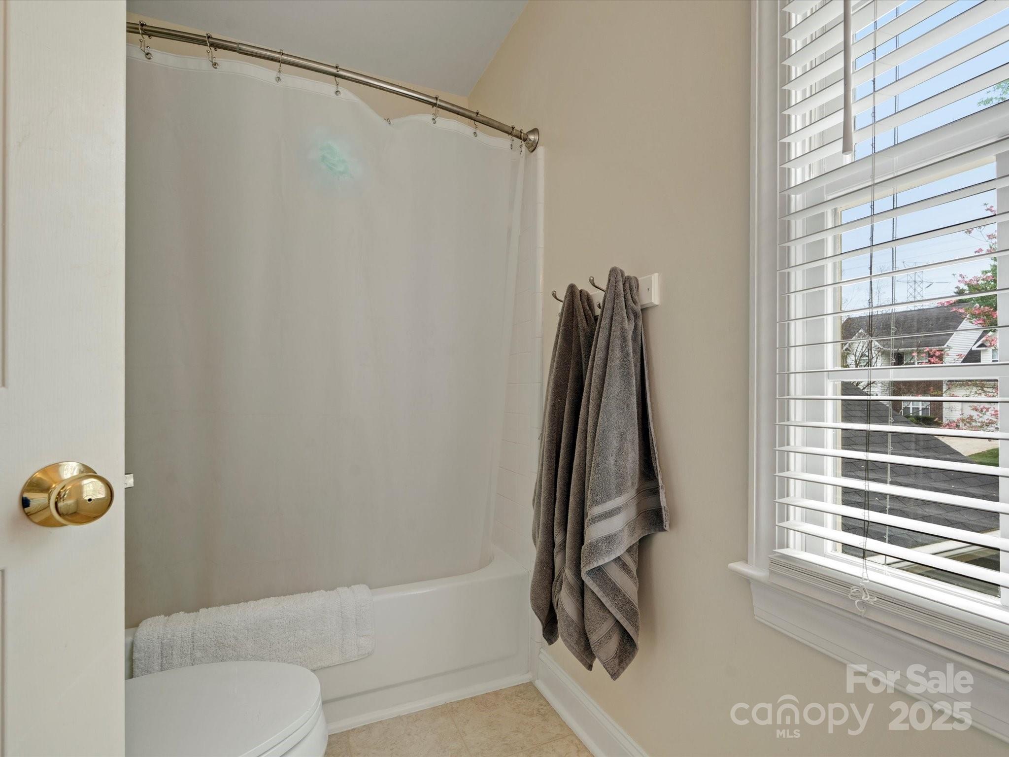 2812 Edgebrook Circle Matthews, NC 28105 - Photo 28 of 46 a bathroom with a shower and a window