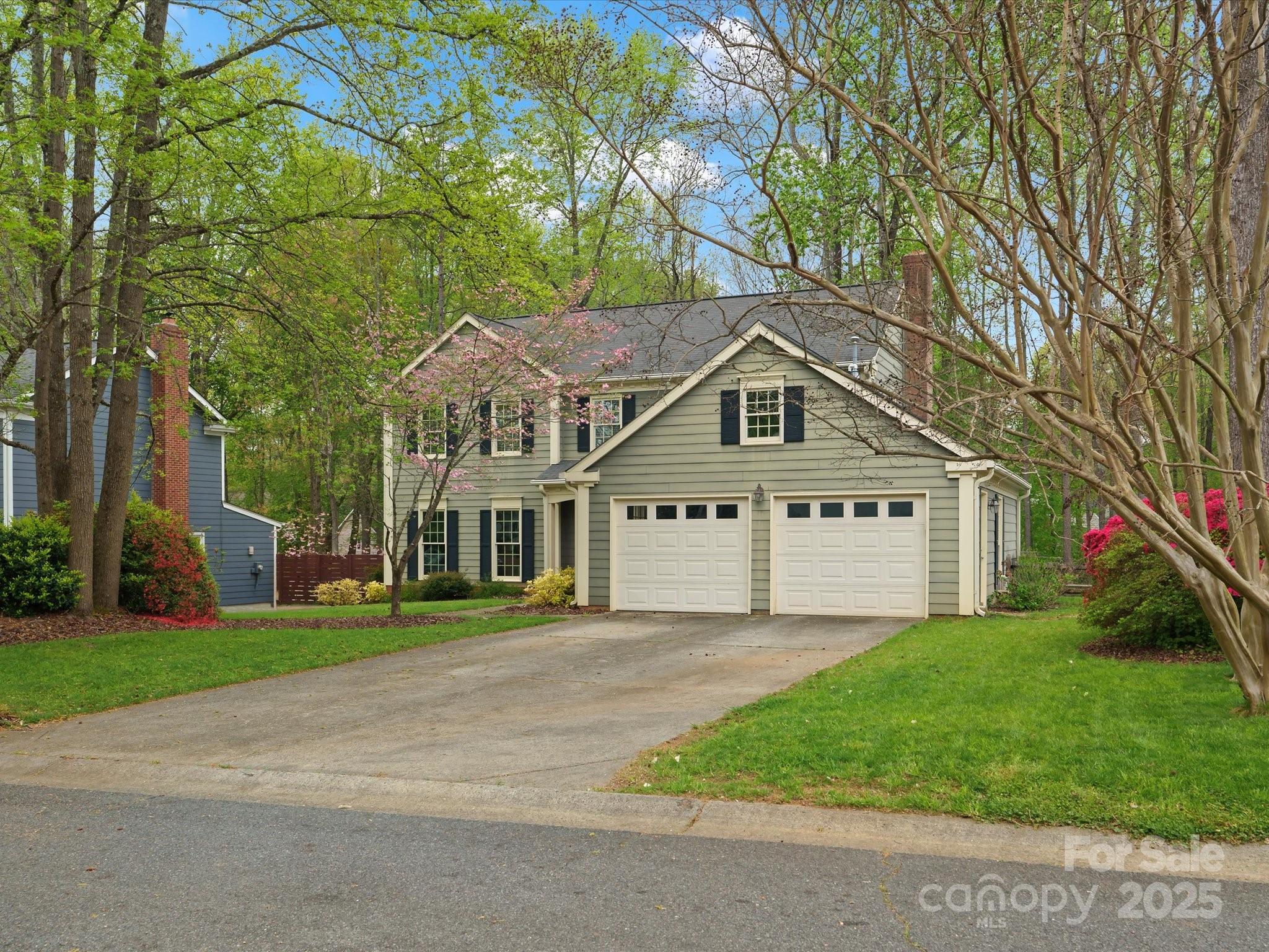 2812 Edgebrook Circle Matthews, NC 28105 - Photo 45 of 46 a front view of a house with a garden and trees