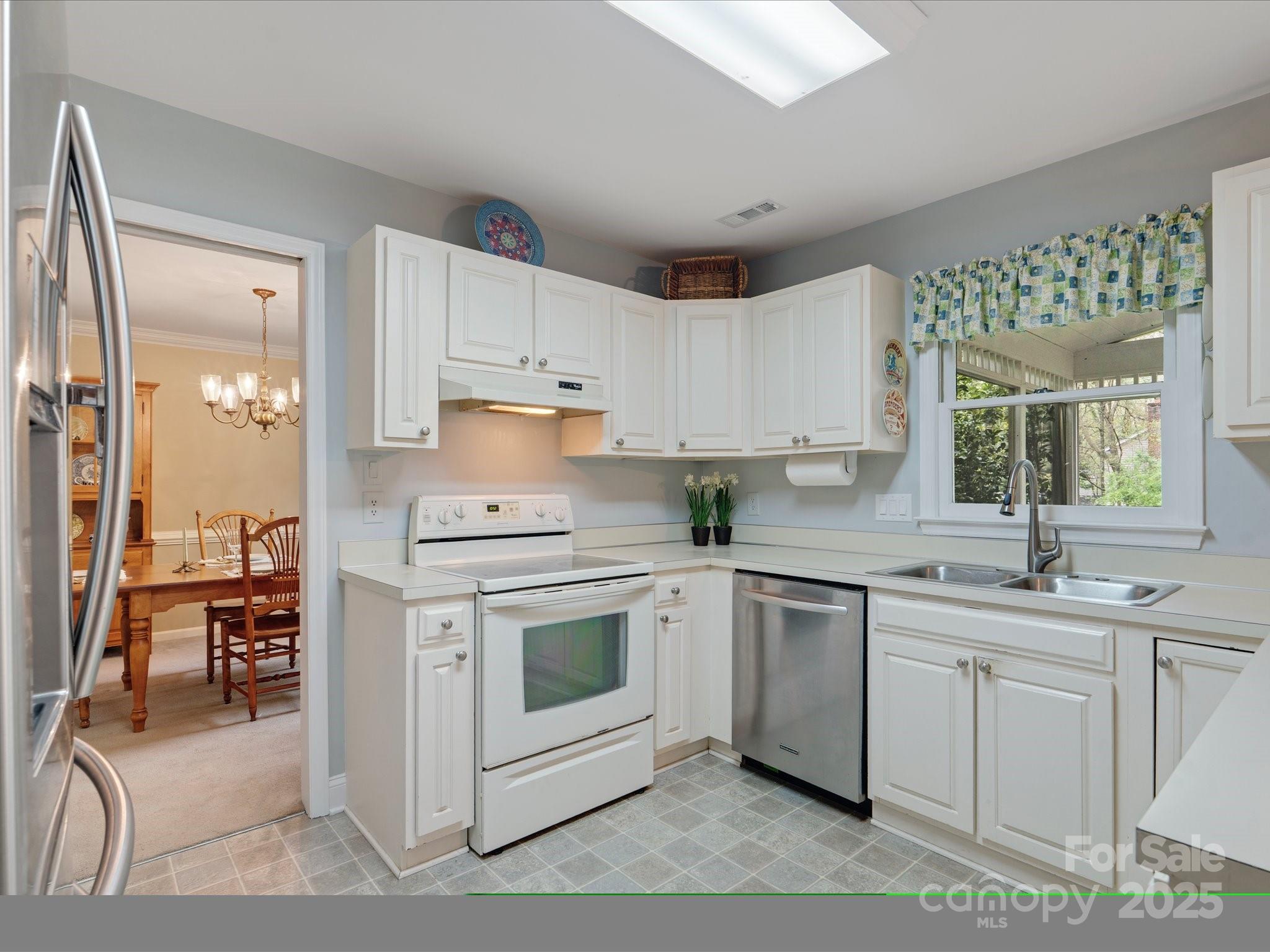 2812 Edgebrook Circle Matthews, NC 28105 - Photo 10 of 46 a kitchen with white cabinets appliances and a sink