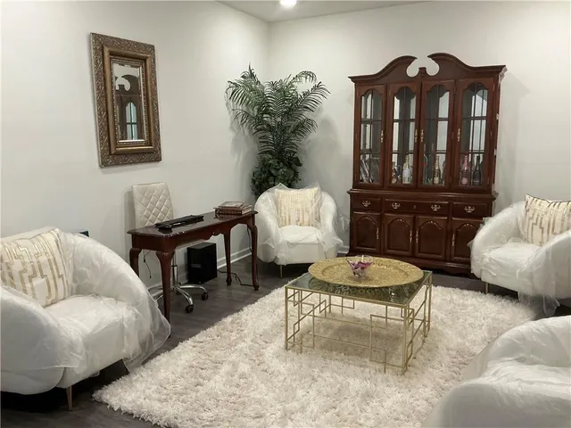a living room with furniture and a rug
