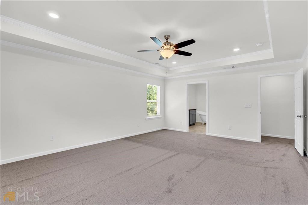 860 North Bethany Road McDonough, GA 30252 - Photo 32 of 57 a view of an empty room and a ceiling fan