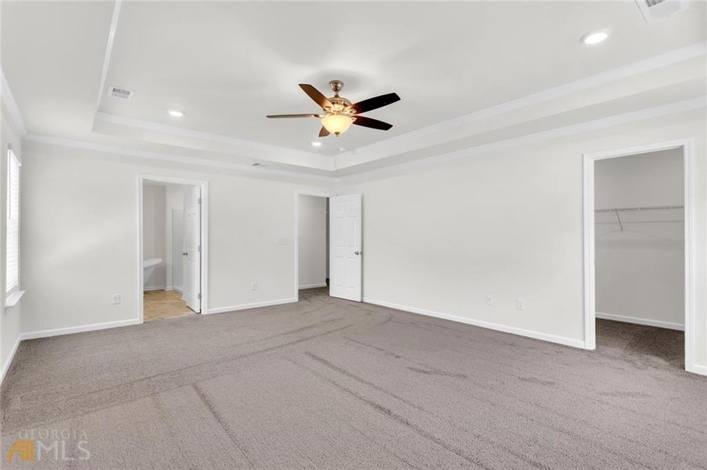 860 North Bethany Road McDonough, GA 30252 - Photo 33 of 57 an empty room with closet and a ceiling fan