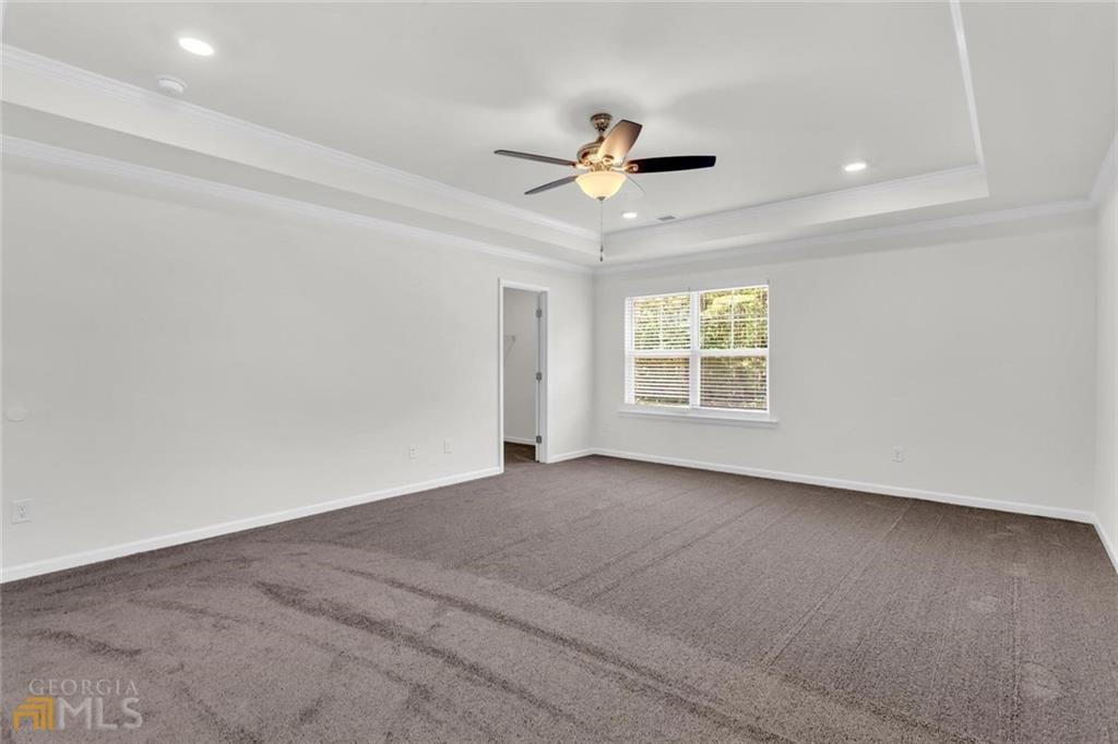 860 North Bethany Road McDonough, GA 30252 - Photo 34 of 57 an empty room with windows and fan