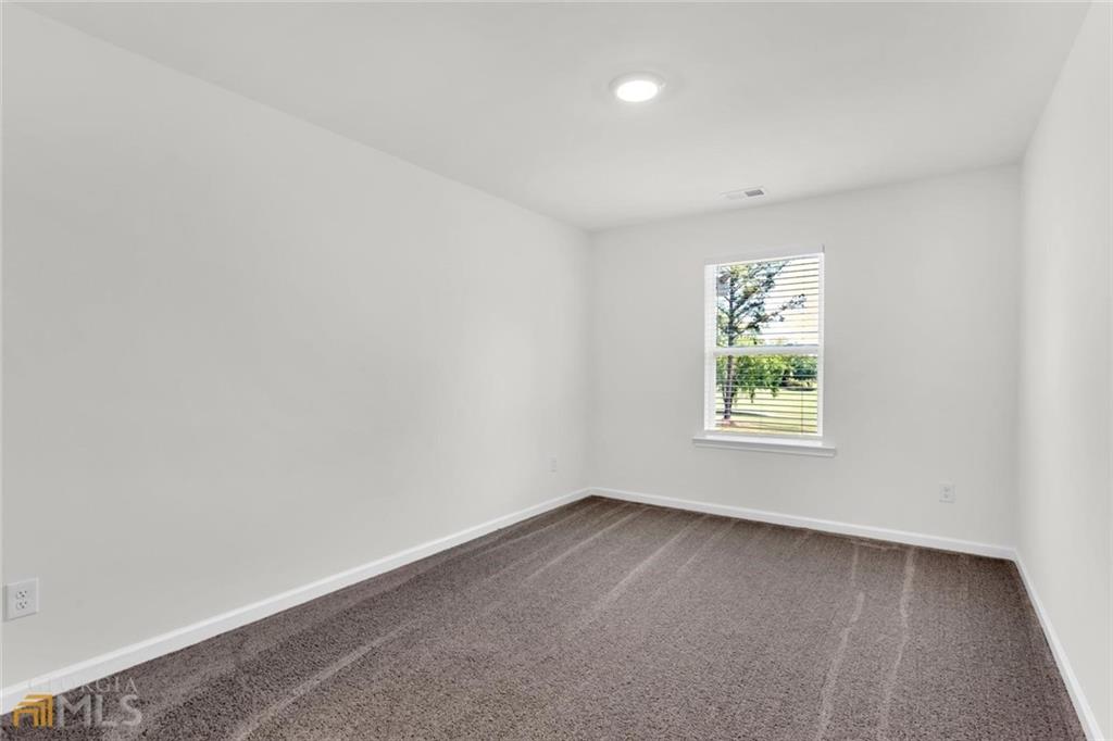860 North Bethany Road McDonough, GA 30252 - Photo 42 of 57 an empty room with a window