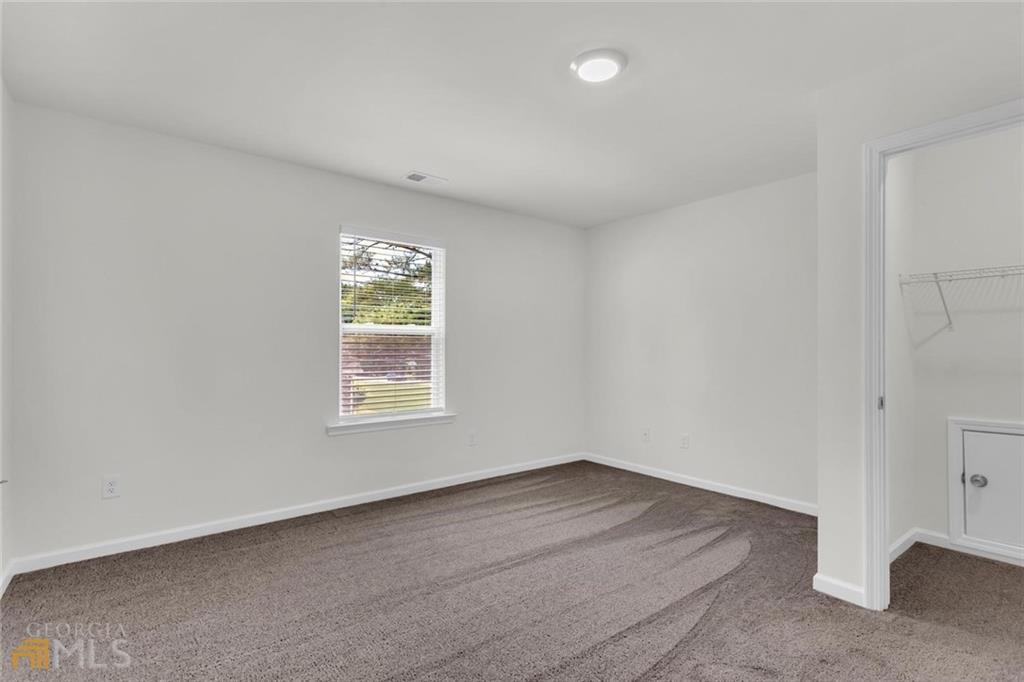 860 North Bethany Road McDonough, GA 30252 - Photo 46 of 57 a view of an empty room with a window