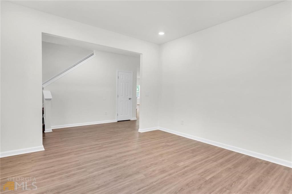 860 North Bethany Road McDonough, GA 30252 - Photo 49 of 57 a view of an empty room with wooden floor