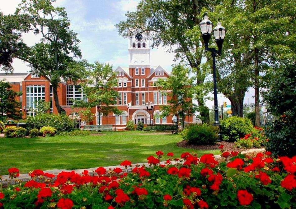 860 North Bethany Road McDonough, GA 30252 - Photo 9 of 57 a view of a white and red flower garden in front of a house
