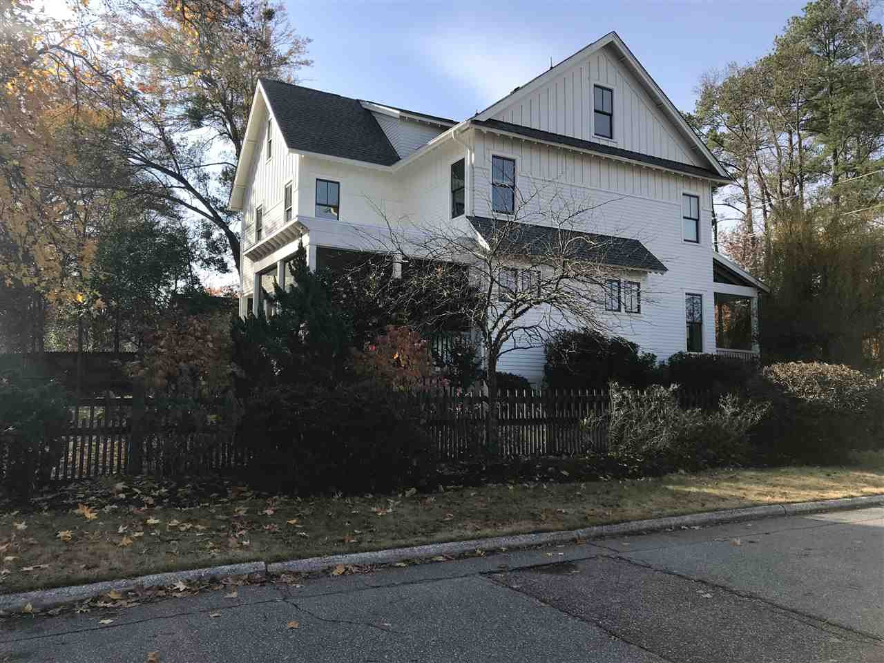 2100 Wiggs Street Raleigh, NC 27608 - Photo 1 of 3 a front view of a house with a yard and garage