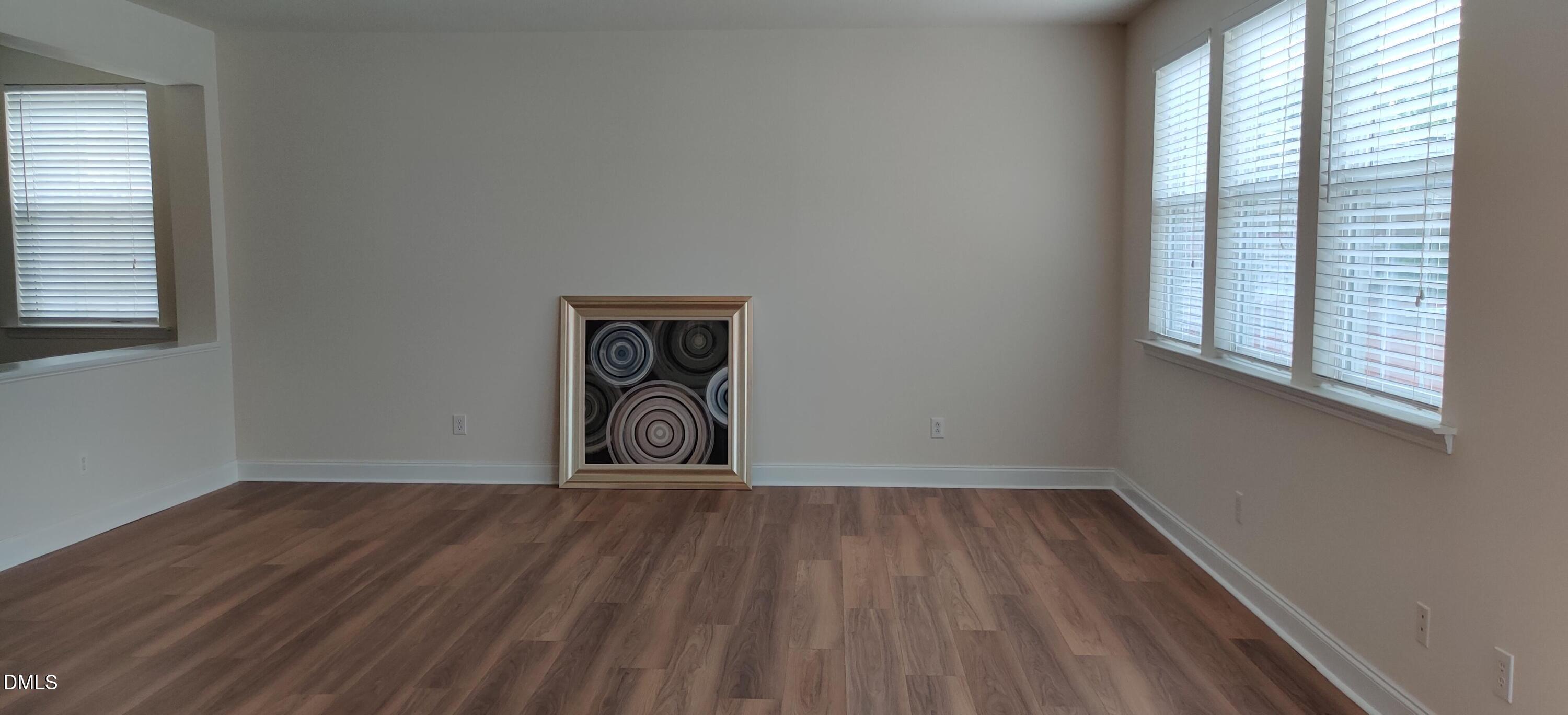 4011 Oatgrass Lane Raleigh, NC 27604 - Photo 7 of 21 a view of a room with wooden floor and a window