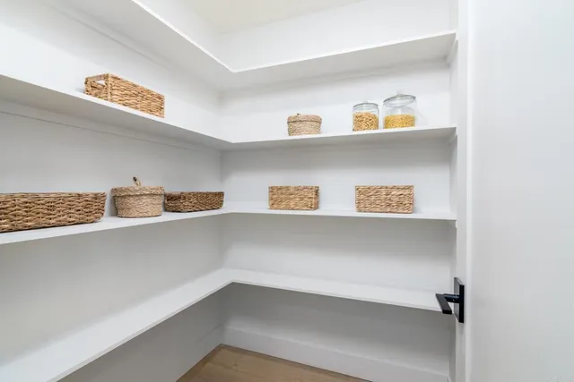 a spacious bedroom with a bed and a couch